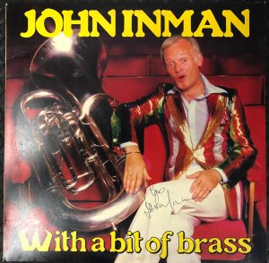 John Inman With The Webb Ivory Newhall Band And The West Midlands Police Male Voice Choir - With A Bit Of Brass (LP) Signed Version 15784